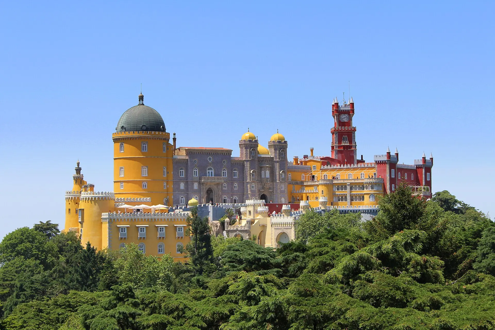 The colourful towers of Pena Palace seen from a distance
